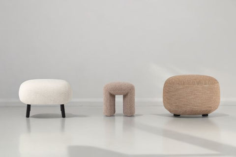 three ready-made ottomans and footstools on a white background