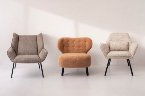 three ready-made accent chairs on a white background